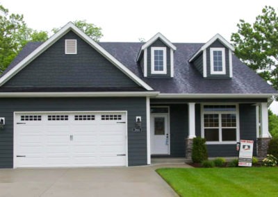 Dark Gray House With White Garage