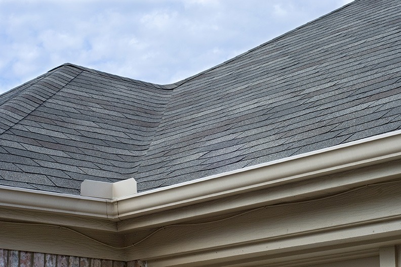 Rain Gutters Splash Guard on Roof against blue sky gutter system