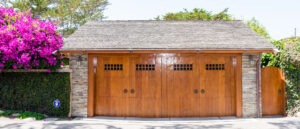 straight on view of a home with a wooden garage door