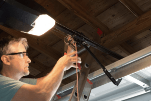 close up of man making common garage door repair