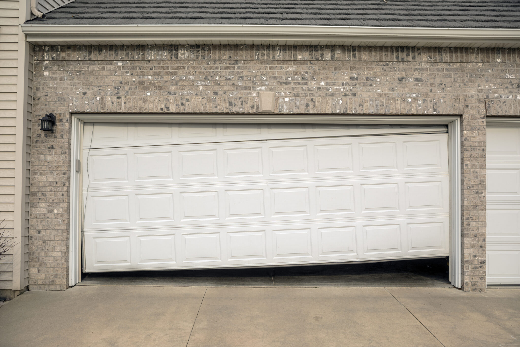 House with crooked garage door problems